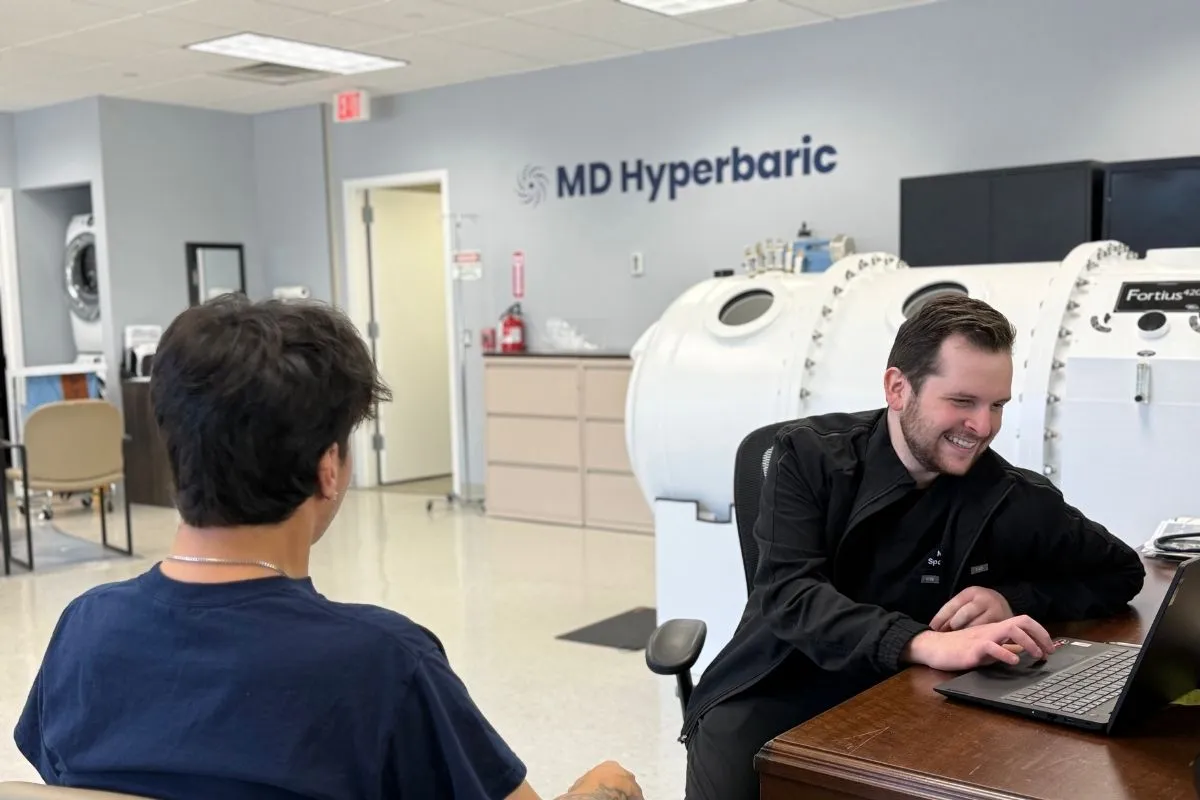 Patient being checked in beside an MD Hyperbaric chamber